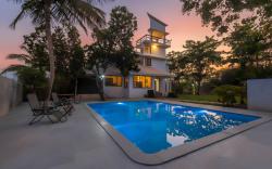 StayVista's Santoni Farms - Riverside Bliss with Pool, Orchard & Activities