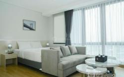 Studio Room @ Capitol Suites Apartment By Travelio