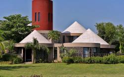 StayVista's Villa Kornet - Mountain-view luxury with a swimming pool and a spacious lawn adorned wit