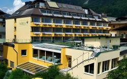Hotel Norica - Thermenhotels Gastein mit dem Bademantel direkt in die Therme