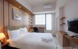 Cozy Studio at Evenciio Apt Margonda By Travelio