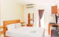 Cozy Studio at Bassura City Apartment By Travelio