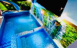 Refreshing 4 bedroom home with a waterfall pools