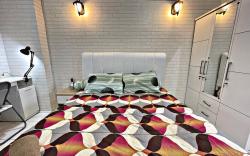 Bright cozy studio 1BR cityview, SmartTV,FAST Wifi