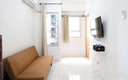 Homey 2BR at Puncak Permai Apartment By Travelio