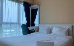 Warm and Cozy 2BR at Tifolia Apartment By Travelio