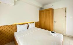 Comfort 1BR Patraland Urbano Apartment By Travelio