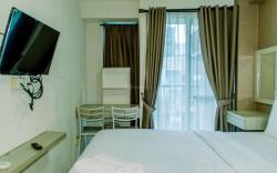 Homey and Warm Studio Room at Tifolia By Travelio