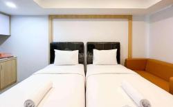 Homey and Cozy Studio at De Prima Apt By Travelio