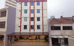 Capital O 90897 Island City Hotel