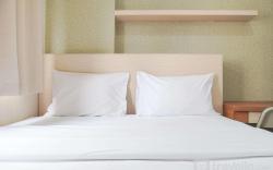 Cozy Stay 1BR at Green Pramuka City By Travelio