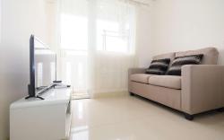 Cozy 2 BR Green Pramuka City Apartment By Travelio