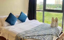 Mactan Newtown 2 BR w/ 4 beds +Pool access