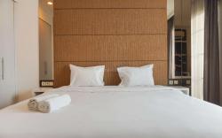 Homey & Strategic Studio Bellezza Apt By Travelio