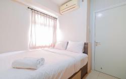 Homey 2BR at Green Pramuka City Apt By Travelio