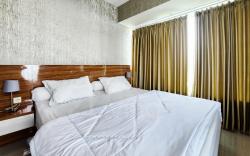 RedLiving Apartemen Grand Kamala Lagoon by Owner Room