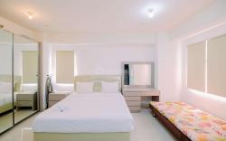 Good & Cozy Studio Green Pramuka City By Travelio