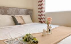 Living 2BR Green Pramuka City Apt By Travelio