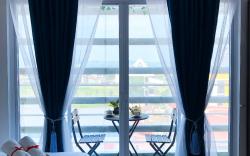 Modern 1BR Condo + Balcony & Pool, next to SM Mall