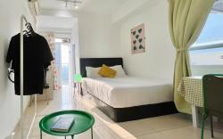 Sun-Kissed, Breezy Studio with a Green Glow