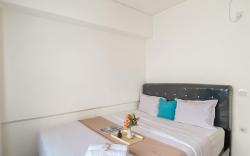 Relaxing Cozy Living 2BR Meikarta Apt By Travelio