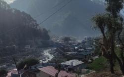 Peaceful place on the river bank and mountain view
