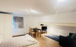 Cozy Basement Fashion District by OneLuxStay