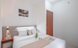 Minimalist 2BR Apt Vittoria Residence By Travelio