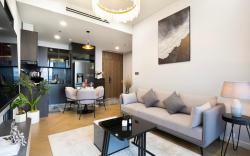 Luxury 2BR Retreat – River Views, Pool, Gym