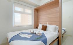 Compact 2BR Apt at Green Pramuka City By Travelio
