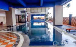 Warm Wood Accents Studio at Mangga Dua By Travelio