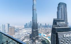 Elegant 4BR High-Rise Overlooking Burj Khalifa & Fountains