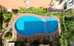 Verdant Condo w/ Pool, Balcony, Near Airport 