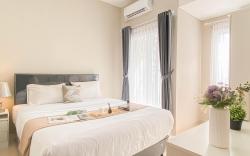 Soft Grey 1BR at Royal Sentul Park By Travelio