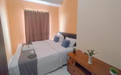 Brown Accent 1BR at Tamansari Prospero By Travelio