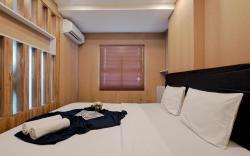 Wooden Accent 2BR at Mekarwangi Square By Travelio