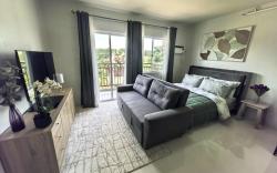 Stylish Condo Stay w/ Pool, Balcony & Near Airport