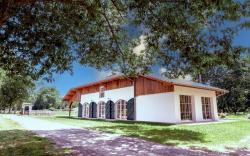 Large house in the forest bordering a lake