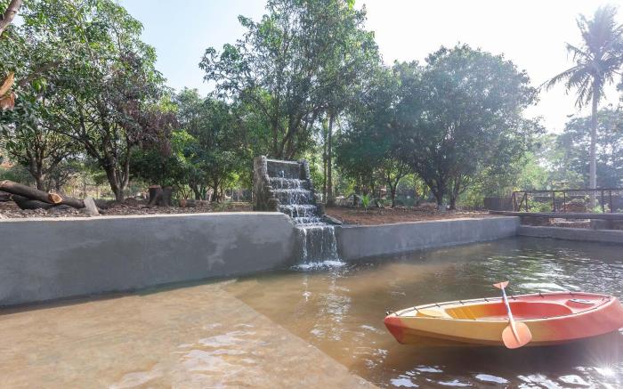 StayVista's Santoni Farms - Riverside Bliss with Pool, Orchard & Activities