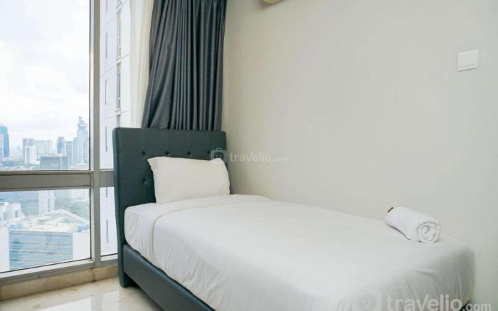 Cozy 2BR Empyreal Epicentrum Apartment By Travelio