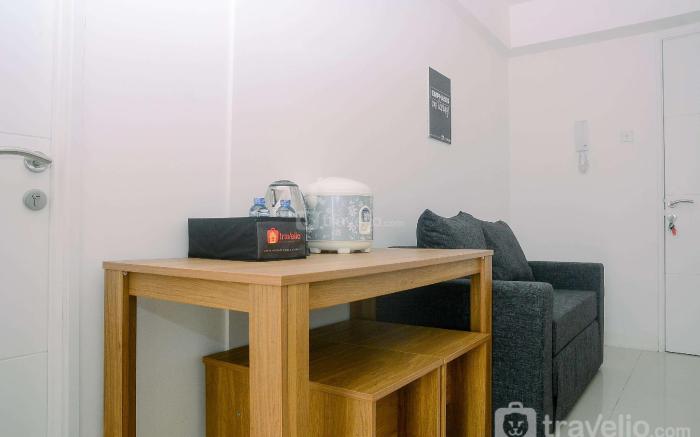 Fully Furnished 1BR Bassura City Apt By Travelio
