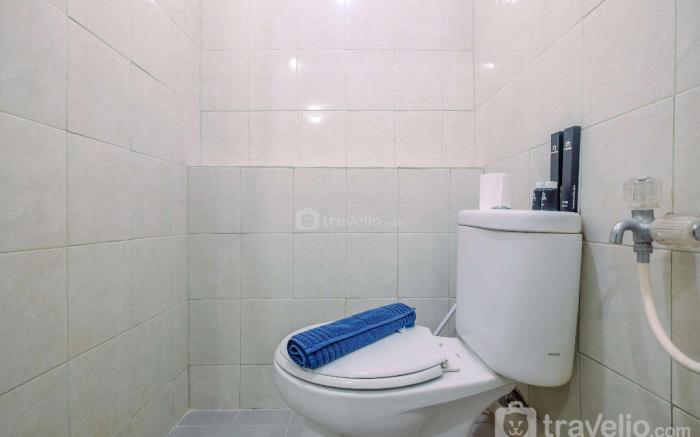 Furnished Green Pramuka 1BR Apartment By Travelio
