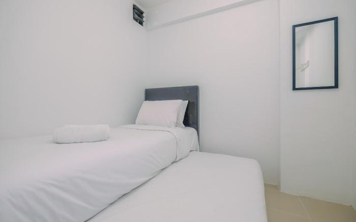 Clean and Simply Cozy 2BR Bassura City Apartment By Travelio