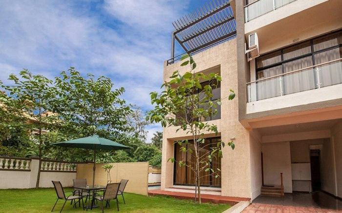 StayVista's Greenwoods Villa 1 - City-Center Villa with Private Pool, Terrace, Lift & Carrom Board
