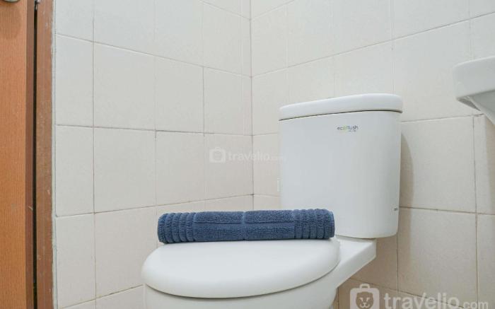Cozy Living 1BR at Tifolia Apartment By Travelio