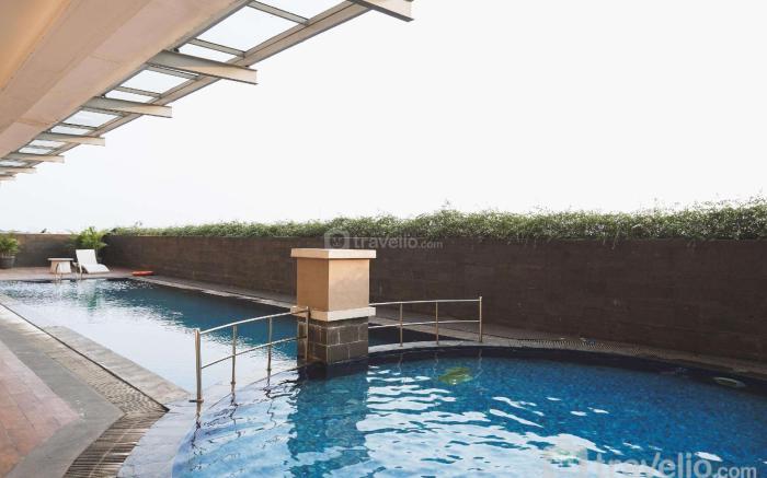Nice & Warm 1BR Belmont Residence Puri By Travelio