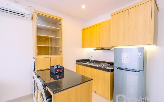 Comfort 1BR Ciputra World 2 Apartment By Travelio