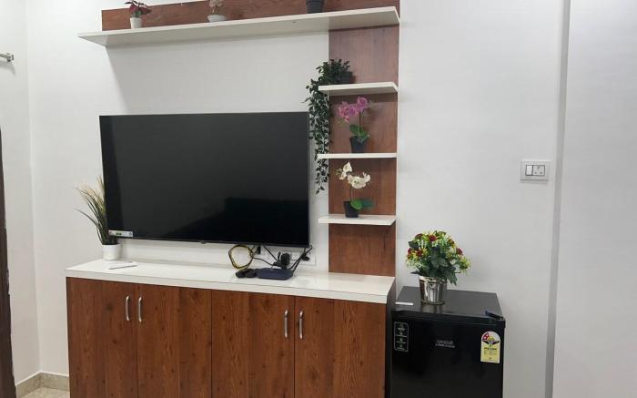 Atlas Homes 1BHK with 55inch TV, Wifi, Geyser, RO