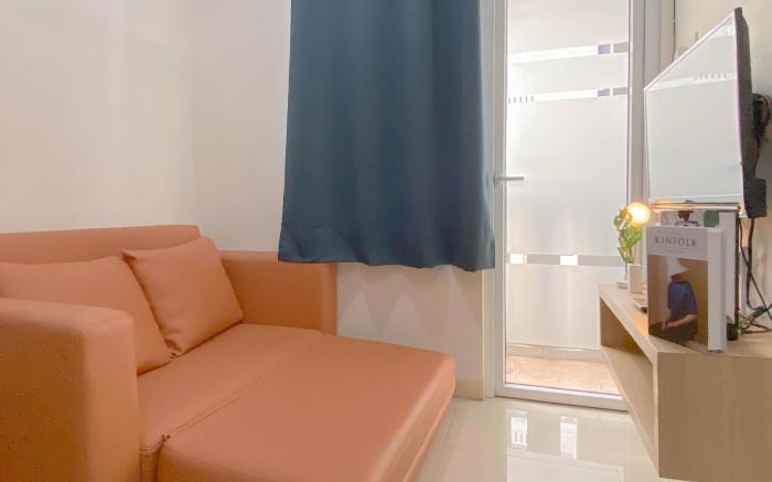 Living 2BR Green Pramuka City Apt By Travelio