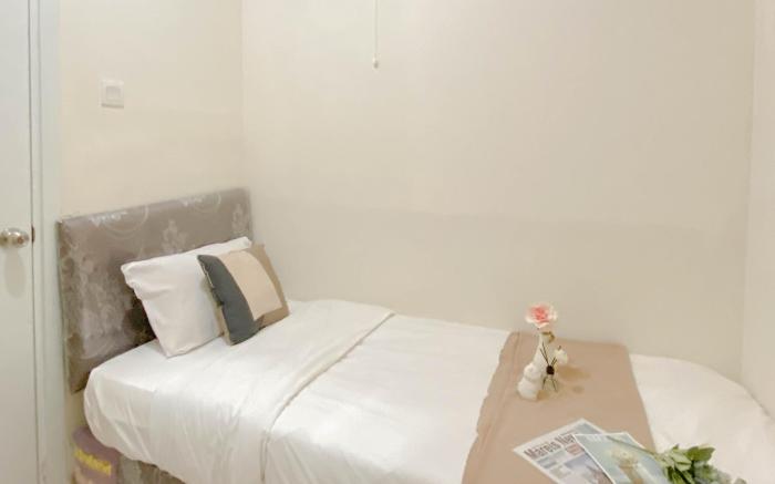 Living 2BR Green Pramuka City Apt By Travelio